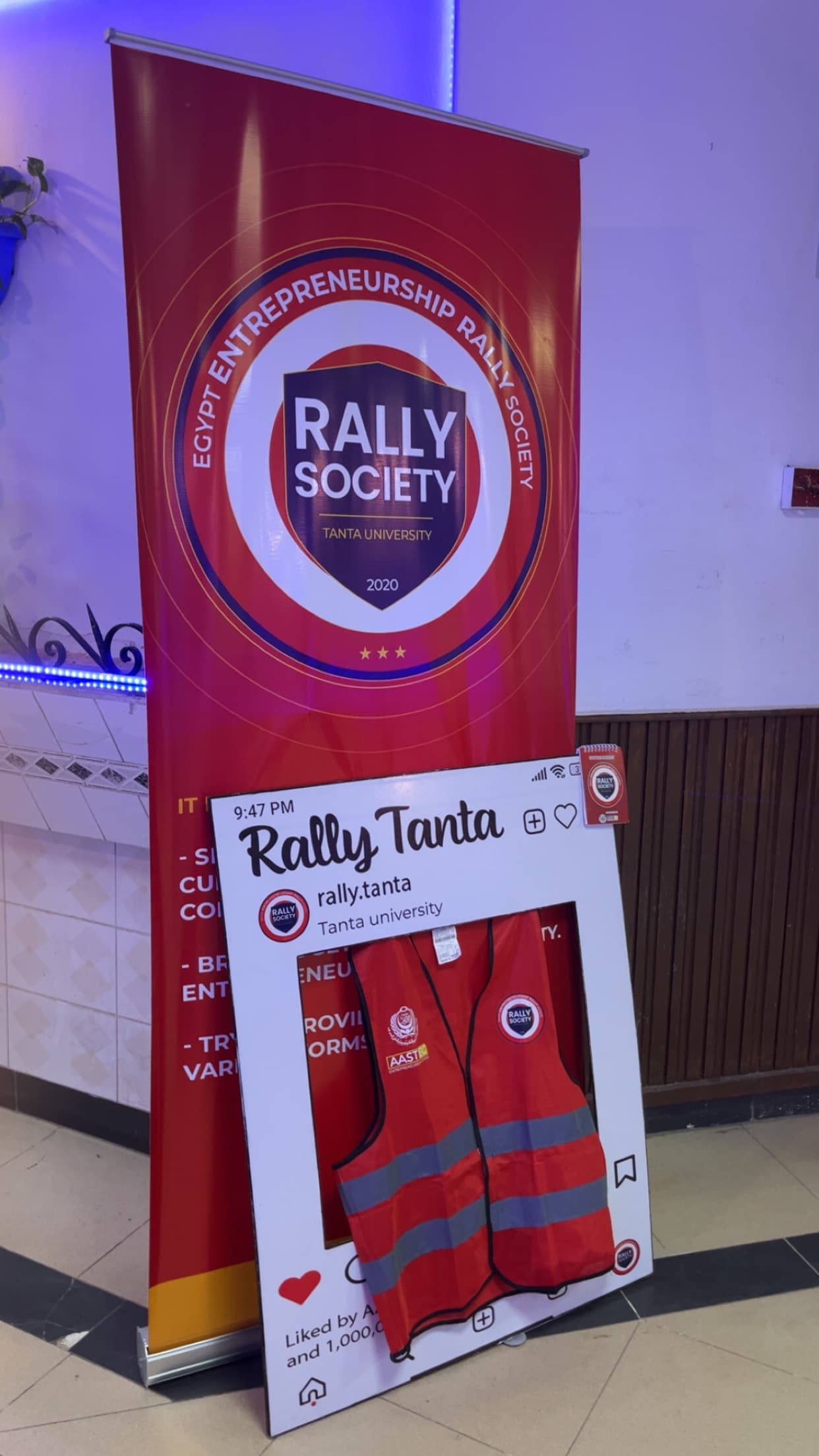 A Rally Tanta volunteer speaking with an event guest